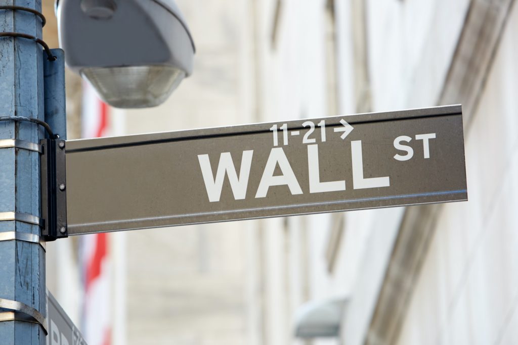 Wall Street sign with street lamp near Stock Exchange in New York